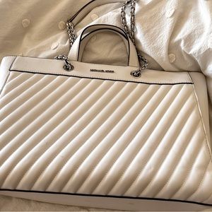 Michael Kors white purse with black piping.  Like new
